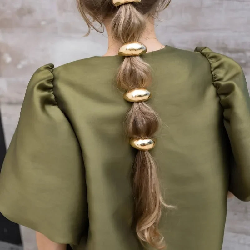 Elegante satijnen top met pofmouwen